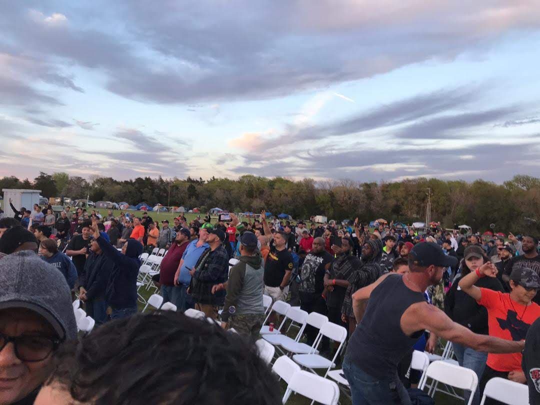Large outdoor gathering with community members