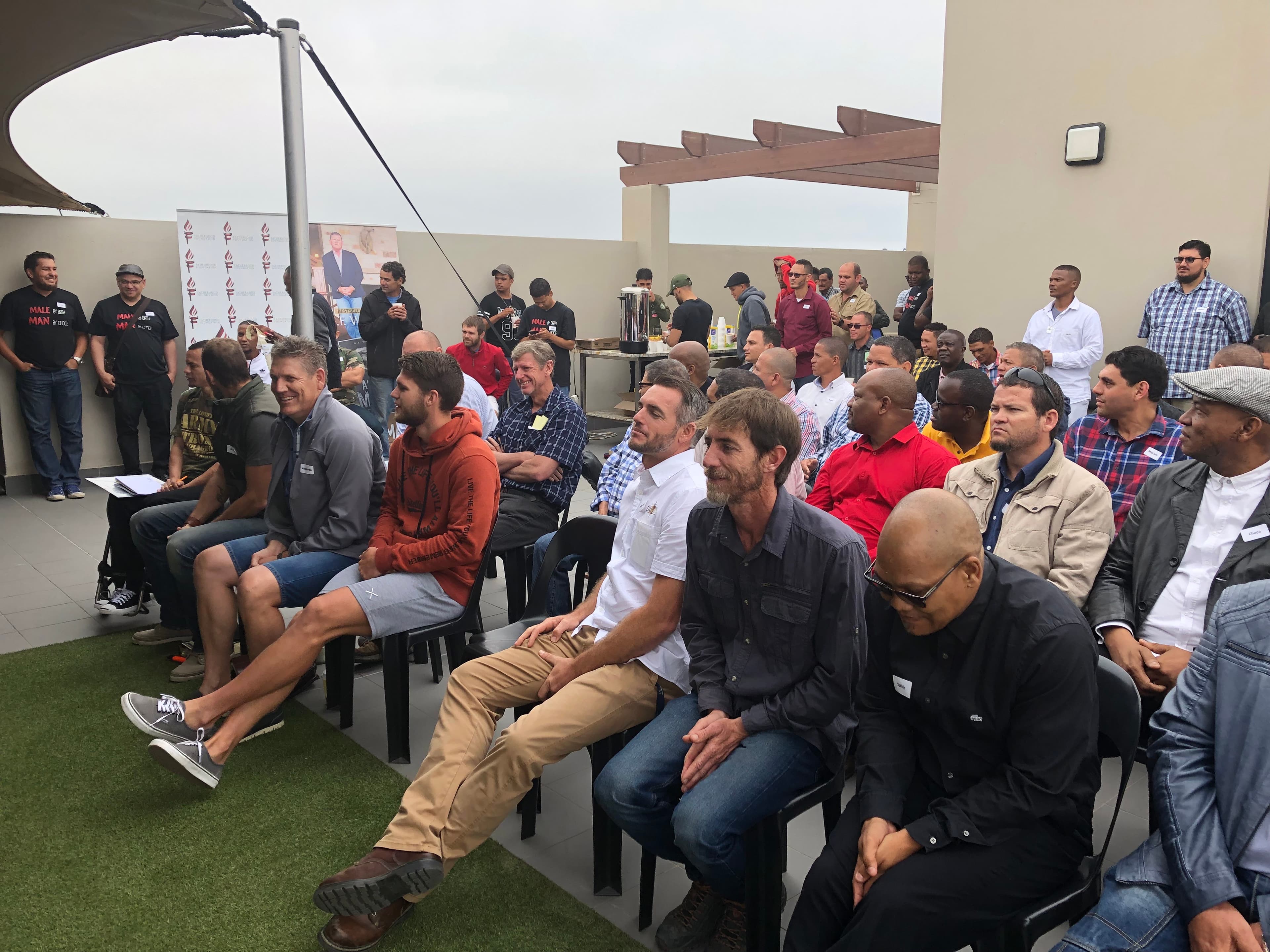 Men attending community seminar